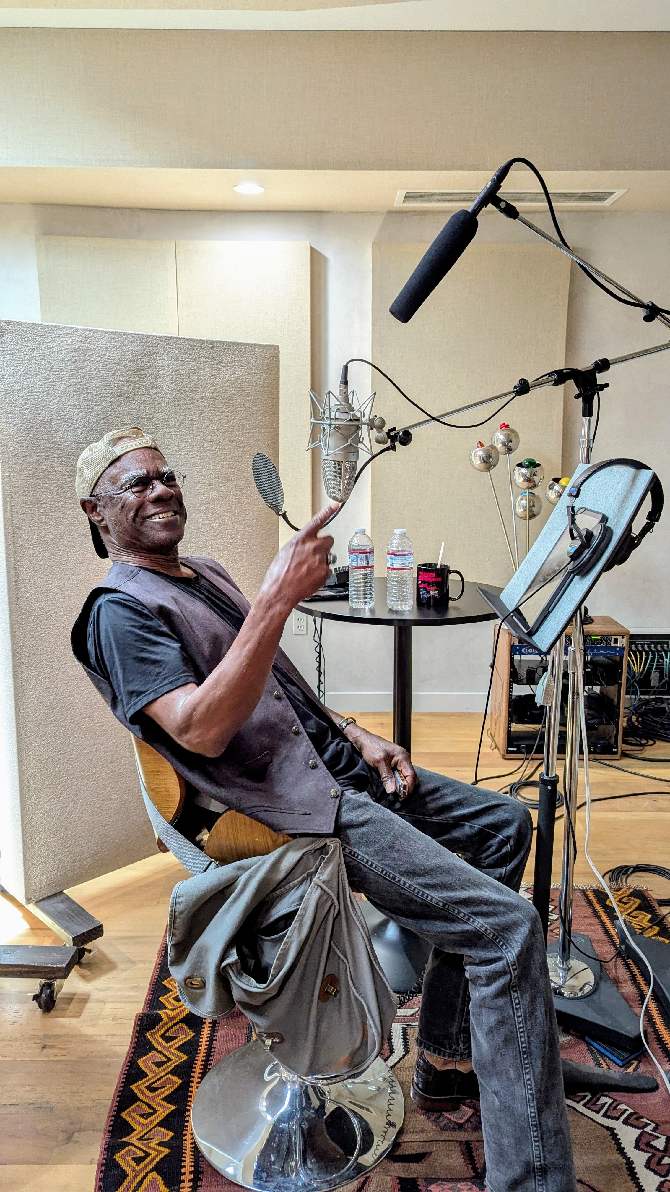 Behind the scenes: an actor recording in a studio.